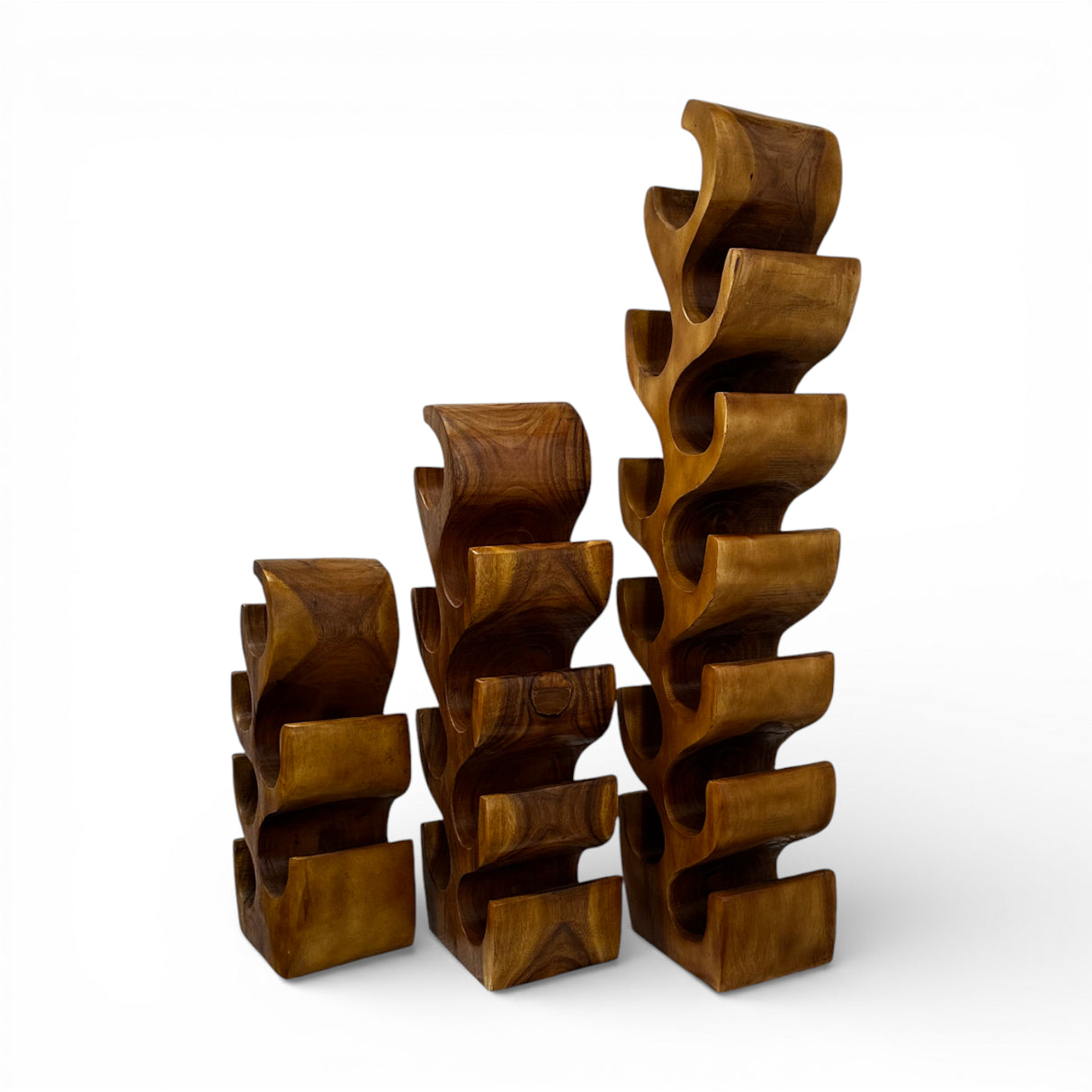 Handcrafted freestanding wine rack carved from solid teak wood, featuring a flowing sculptural design that securely holds multiple wine bottles. Combining functional storage with artistic craftsmanship, this statement wine rack is perfect for dining rooms, wine cellars, boutique hotels, restaurants, or luxury contemporary interiors.