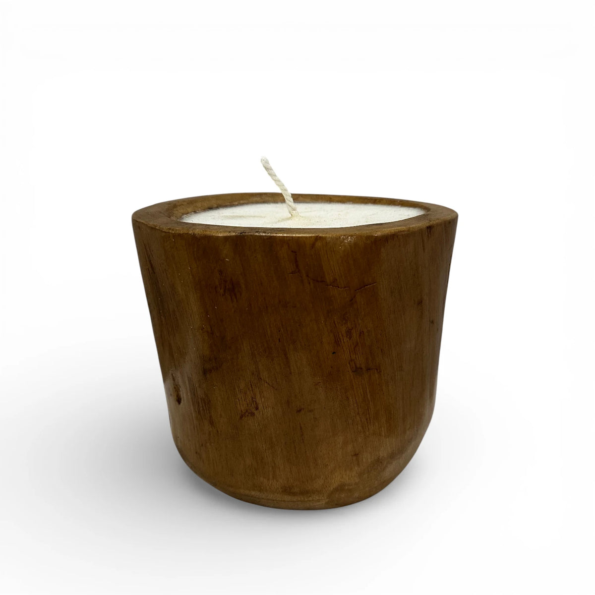 Handcrafted candle poured into a solid teak wood vessel, showcasing the rich natural grain, warm timber tones, and organic handcrafted finish. A timeless rustic-modern décor piece perfect for coffee tables, shelves, dining tables, boutique hotels, spas, or contemporary interiors.