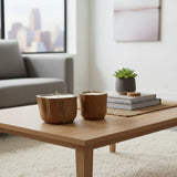 Set of handcrafted candle holders carved from solid teak wood, showcasing the natural grain and organic shape of the timber. Designed to hold tealight or small pillar candles, these rustic-modern décor pieces add warmth and natural elegance to coffee tables, dining tables, shelves, boutique hotels, or contemporary interiors.