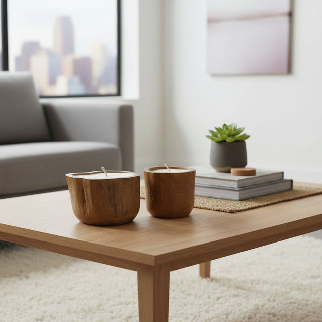 Set of handcrafted candle holders carved from solid teak wood, showcasing the natural grain and organic shape of the timber. Designed to hold tealight or small pillar candles, these rustic-modern décor pieces add warmth and natural elegance to coffee tables, dining tables, shelves, boutique hotels, or contemporary interiors.