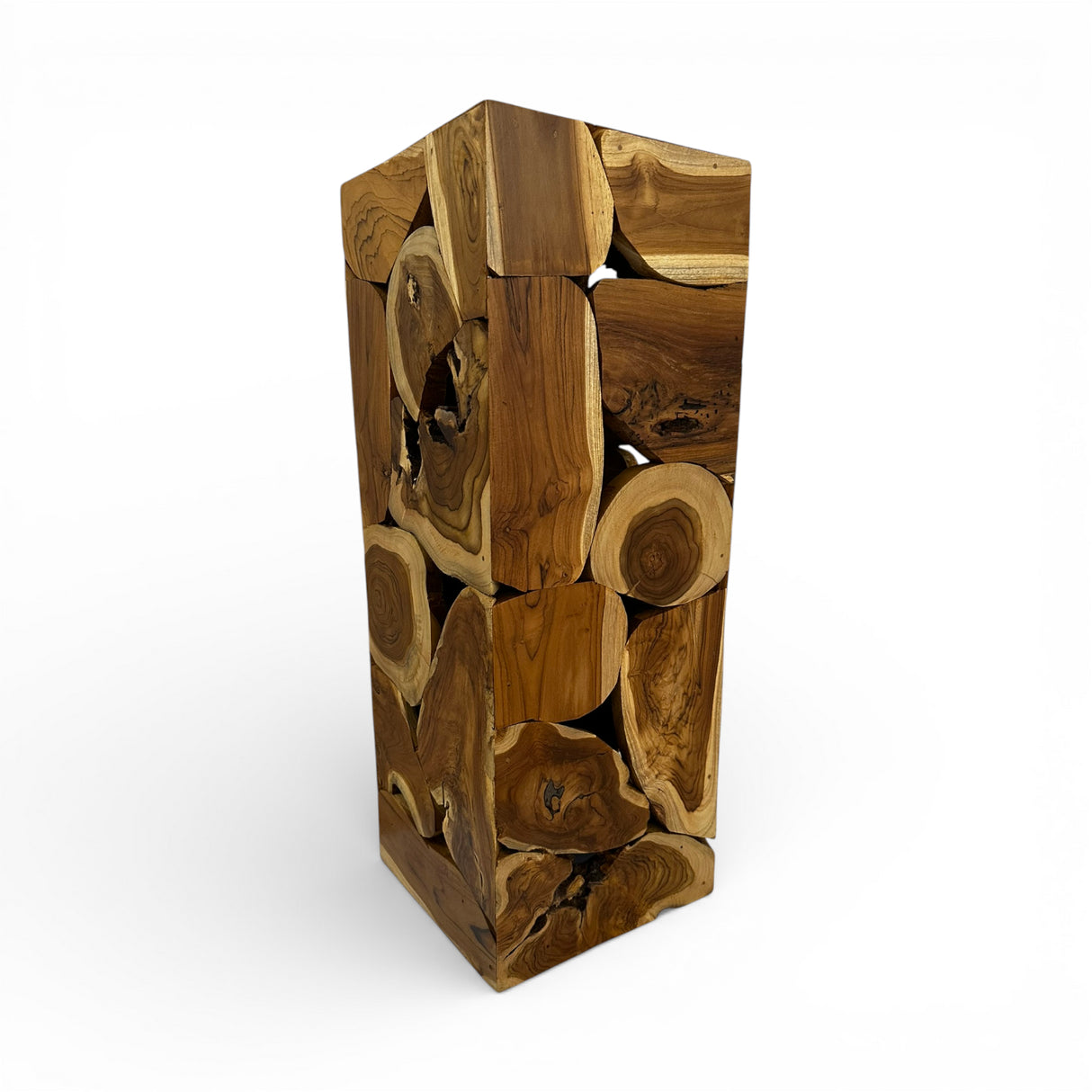 Handcrafted display pedestal made from solid teak wood blocks, featuring a striking patchwork design that showcases the natural grain, knots, and warm timber tones of each piece. Ideal for displaying sculptures, vases, plants, or decorative accessories in living rooms, entryways, galleries, boutique hotels, or contemporary rustic interiors.