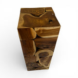 Handcrafted display pedestal made from solid teak wood blocks, featuring a striking patchwork design that showcases the natural grain, knots, and warm timber tones of each piece. Ideal for displaying sculptures, vases, plants, or decorative accessories in living rooms, entryways, galleries, boutique hotels, or contemporary rustic interiors.