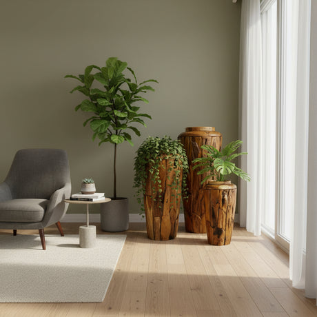 Set of handcrafted teak wood floor vases in varying heights, styled with lush greenery in a modern living space. Featuring rich natural wood grain and organic textures, these statement vases bring warmth and character to contemporary interiors.