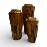 Set of three handcrafted teak wood floor vases in varying heights, showcasing natural wood grain, organic textures, and a rustic finish. Decorative statement pieces ideal for modern, coastal, or contemporary interiors.