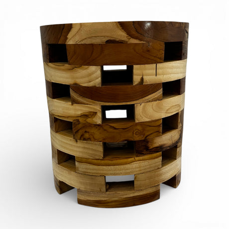 Handcrafted cylindrical side table crafted from solid teak wood, featuring a contemporary open-block design with integrated storage compartments and beautifully contrasting natural wood tones. This functional statement piece is perfect for living rooms, bedrooms, boutique hotels, lodges, or modern rustic interiors.