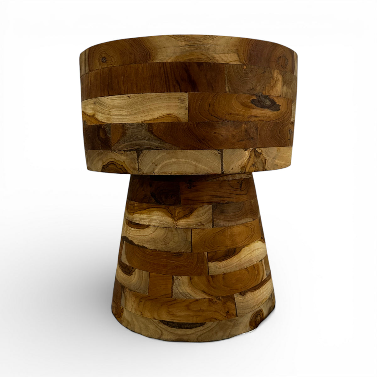 Handcrafted round side table crafted from solid teak wood with a sculptural hourglass pedestal base. Showcasing a unique patchwork of natural timber grain and warm wood tones, this contemporary accent table is perfect for living rooms, bedrooms, boutique hotels, lodges, or modern rustic interiors.