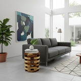 Handcrafted round side table crafted from solid teak wood, featuring a distinctive stacked slatted design with integrated storage compartments and a warm natural timber finish. A functional statement piece perfect for living rooms, bedrooms, boutique hotels, lodges, or contemporary rustic interiors.