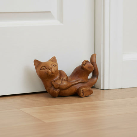 Handcrafted wooden cat door stop featuring a playful reclining cat design with a natural wood finish. This decorative door wedge combines functionality with charm, making it ideal for modern, rustic, farmhouse, or animal-inspired home décor.