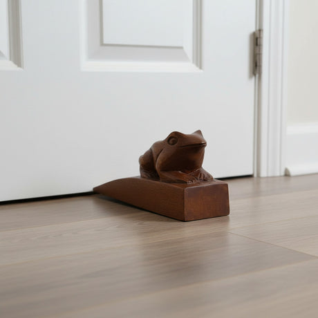Handcrafted wooden frog door stop with a rich natural finish, designed to keep doors securely open while adding a charming decorative touch to modern, rustic, farmhouse, or nature-inspired interiors.