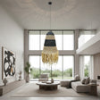 Handwoven pendant light featuring black and natural woven bands with a tapered silhouette and decorative fringe, creating warm ambient lighting and a relaxed bohemian statement for dining rooms, bedrooms, living spaces, or covered patios.