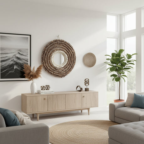 Round decorative wall mirror featuring a handwoven natural fibre frame with layered textured detailing. Inspired by coastal and bohemian design, this statement mirror adds warmth and organic elegance to living rooms, bedrooms, entryways, boutique hotels, or contemporary interiors.