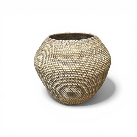 Handwoven natural decorative bowl with a rounded organic silhouette and light neutral finish. This handcrafted woven accent adds warmth and texture to coffee tables, consoles, shelves, and dining spaces in coastal, Scandinavian, boho, and modern interiors.