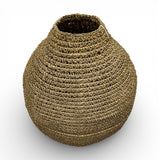 Handwoven natural decorative vase with a rounded sculptural silhouette, narrow neck, and richly textured woven finish, perfect for displaying dried botanicals or adding warm organic texture and artisanal charm to contemporary, coastal, or rustic interiors.