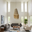 Handwoven natural pendant light featuring a tapered woven shade with decorative raffia fringe, creating warm ambient lighting and a relaxed organic statement for dining rooms, living spaces, bedrooms, or covered patios.