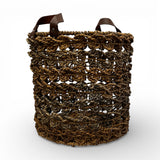 Handwoven open-weave storage basket with rich natural fibres and genuine leather carry handles, perfect for storing blankets, cushions, magazines, or everyday essentials while adding warm organic texture and contemporary artisanal style to modern, coastal, and rustic interiors.