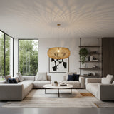 Contemporary handwoven oval rattan pendant light featuring a natural woven finish and an open-weave design that casts beautiful decorative light patterns across the ceiling. A striking statement ceiling light ideal for dining rooms, living spaces, boutique hotels, restaurants, and modern interiors.
