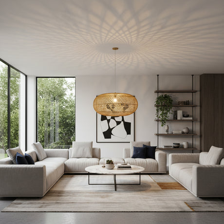 Contemporary handwoven oval rattan pendant light featuring a natural woven finish and an open-weave design that casts beautiful decorative light patterns across the ceiling. A striking statement ceiling light ideal for dining rooms, living spaces, boutique hotels, restaurants, and modern interiors.