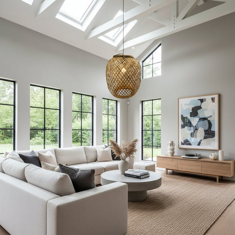 Handwoven natural rattan pendant light with an open lattice weave and rounded silhouette, suspended in a bright contemporary living space, adding warm organic texture and timeless style.