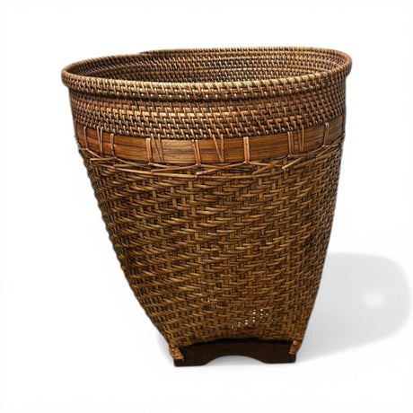 Handwoven rattan storage basket featuring a rich natural finish, intricate woven texture, and a tapered silhouette. Ideal for storing blankets, cushions, toys, or household essentials while adding warmth to modern, coastal, boho, Scandinavian, or rustic home décor.