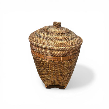 Handwoven rattan storage basket with a fitted lid, intricate woven texture, and warm natural finish. Ideal for storing blankets, laundry, toys, or household essentials while complementing modern, coastal, boho, Scandinavian, and rustic home interiors.