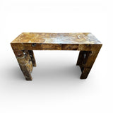 Handcrafted reclaimed wood console table featuring a natural live-edge design, rich organic wood grain, and sculptural cut-out legs, showcased on a clean white background.