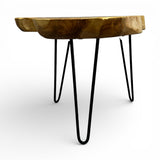 Handcrafted side table featuring a solid live edge wooden tabletop with a natural organic finish and sleek black metal hairpin legs. Combining rustic craftsmanship with modern industrial style, this versatile accent table is ideal for living rooms, bedrooms, boutique hotels, or contemporary interiors.
