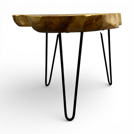 Handcrafted side table featuring a solid live edge wooden tabletop with a natural organic finish and sleek black metal hairpin legs. Combining rustic craftsmanship with modern industrial style, this versatile accent table is ideal for living rooms, bedrooms, boutique hotels, or contemporary interiors.