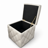 Cream square tufted storage ottoman with button detailing and a removable lid, perfect for extra seating, hidden storage, and contemporary living spaces.