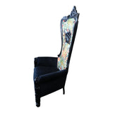 Elegant high-back throne chair featuring an ornate black carved wooden frame, black upholstered armrests and seat, and a vibrant floral-patterned fabric backrest, creating a bold statement for luxurious living spaces, boutique hotels, or elegant lounges.