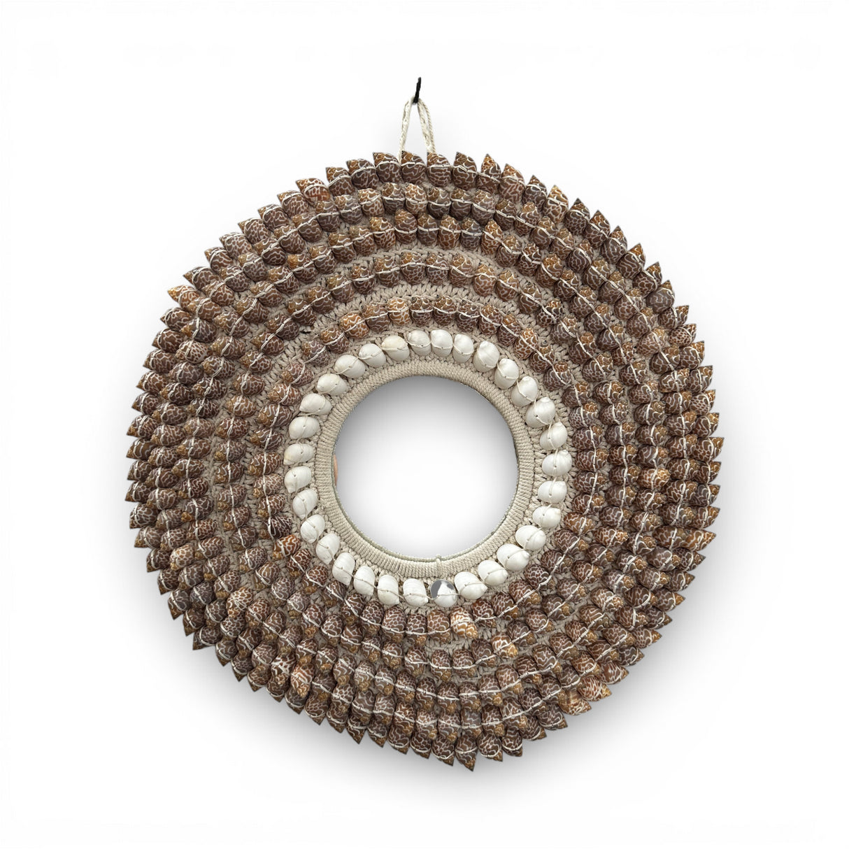 Round decorative wall mirror handcrafted with a woven natural fibre frame and layered rows of patterned and white seashells. This coastal-inspired statement mirror brings texture, warmth, and artisan craftsmanship to living rooms, bedrooms, entryways, boutique hotels, or luxury beach-style interiors.