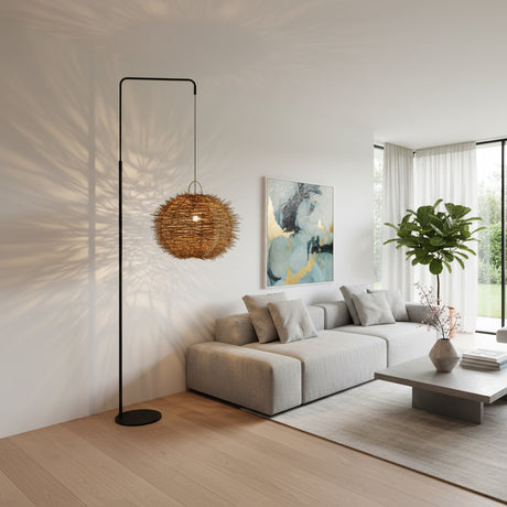 Contemporary arc floor lamp featuring a sleek black metal frame and a handwoven spherical rattan shade with a textured natural finish. The sculptural design casts beautiful decorative light patterns, making it a striking statement lighting piece for living rooms, reading corners, boutique hotels, and modern interiors.