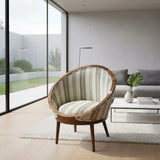 Contemporary barrel accent chair featuring a solid wood frame, neutral striped upholstered fabric, and tapered wooden legs. A stylish occasional chair that brings warmth and modern sophistication to living rooms, reading nooks, bedrooms, or boutique hotel lounges.