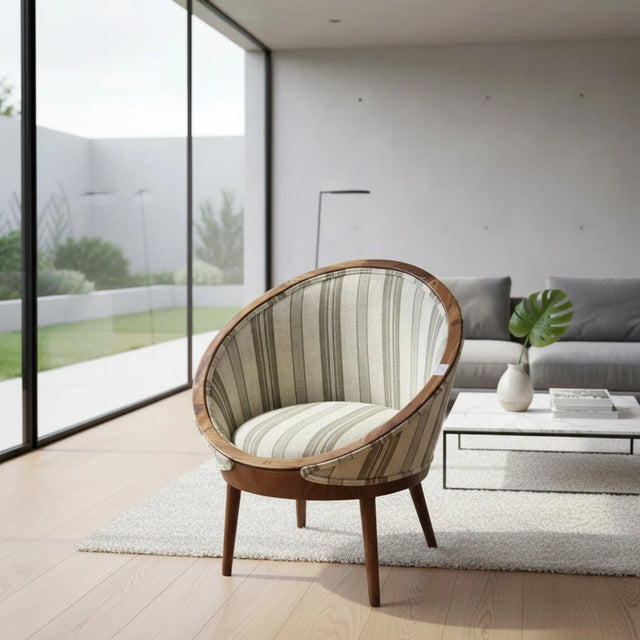 Contemporary barrel accent chair featuring a solid wood frame, neutral striped upholstered fabric, and tapered wooden legs. A stylish occasional chair that brings warmth and modern sophistication to living rooms, reading nooks, bedrooms, or boutique hotel lounges.