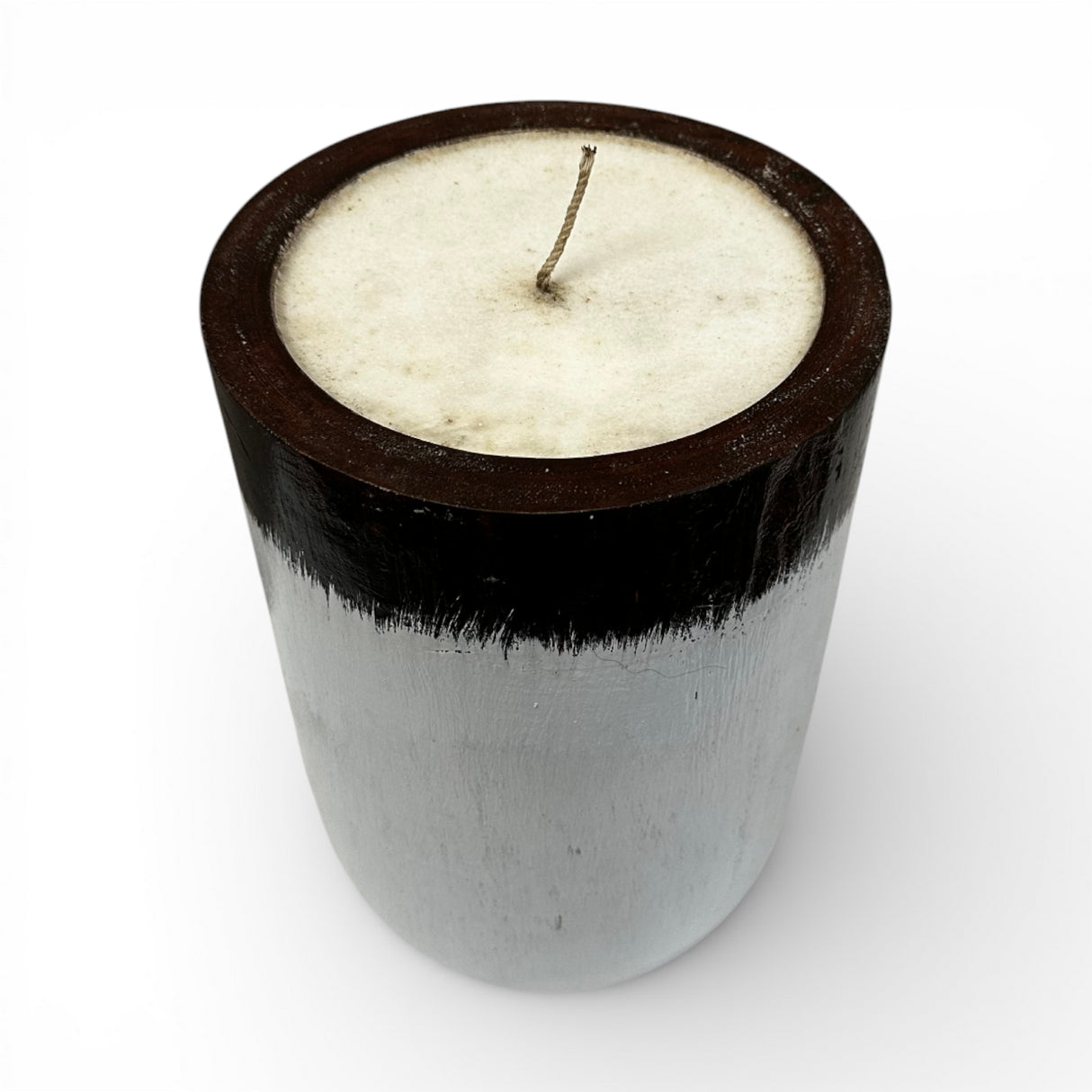 Handcrafted candle in a solid wooden vessel featuring a contemporary black and white two-tone finish with a smooth natural wax fill. A stylish decorative accent that brings warmth and modern elegance to coffee tables, shelves, bedrooms, boutique hotels, spas, or minimalist interiors.