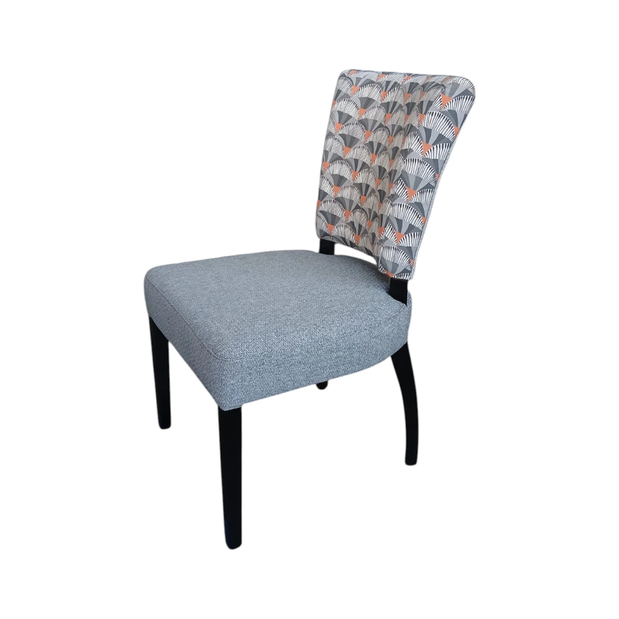 Modern upholstered dining chair with a soft grey fabric seat, an Art Deco-inspired patterned backrest in grey, charcoal and muted terracotta tones, and sleek black wooden legs. Perfect for contemporary dining rooms, restaurants, and luxury interiors.
