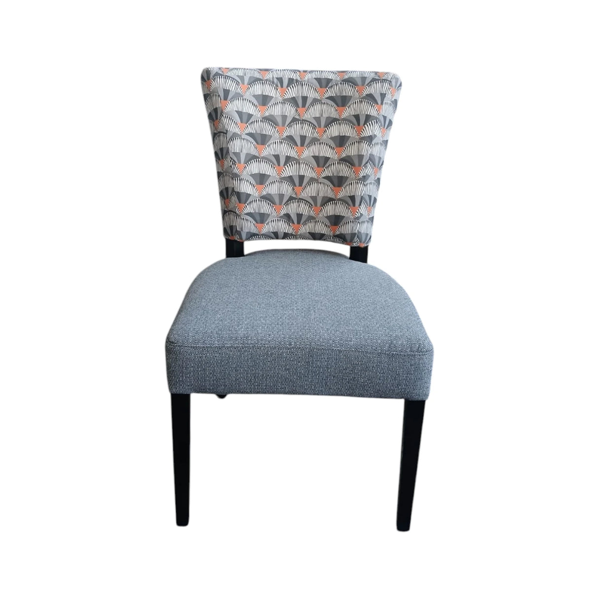 Modern upholstered dining chair with a soft grey fabric seat, an Art Deco-inspired patterned backrest in grey, charcoal and muted terracotta tones, and sleek black wooden legs. Perfect for contemporary dining rooms, restaurants, and luxury interiors.