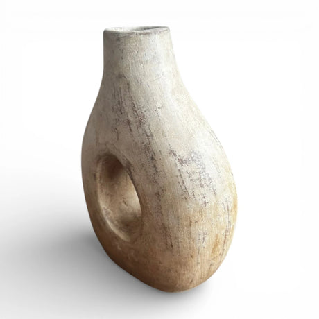 Natural donut decorative vase featuring a sculptural circular cut-out, organic rounded silhouette, and weathered sand-coloured finish. A contemporary statement décor piece perfect for dried botanicals, shelves, consoles, coffee tables, and modern, Scandinavian, boho, wabi-sabi, or minimalist interiors.