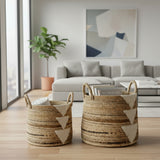 Woven baskets with geometric patterns on a wooden floor in a modern living room.