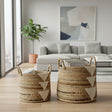 Woven baskets with geometric patterns on a wooden floor in a modern living room.
