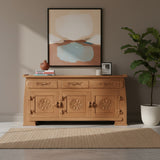 Elegant natural wood sideboard featuring three drawers and three cabinet doors with intricate floral medallion carvings and decorative detailing.