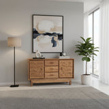 Elegant natural wood sideboard featuring four central drawers and two cabinet doors with intricate floral carvings, raised on short wooden legs for a refined handcrafted look.