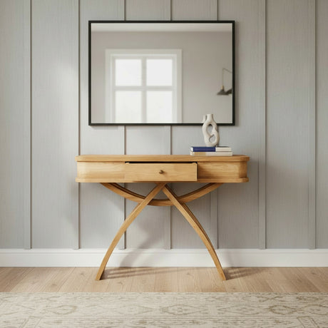Elegant natural wood console table featuring a central drawer, distinctive curved cross-leg design, and a smooth wooden top for a refined contemporary look.