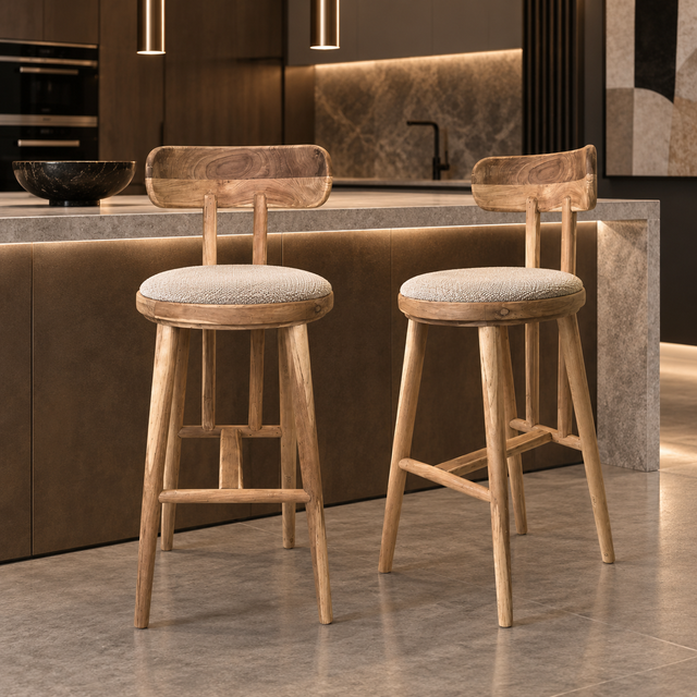 Two natural wood bar stools with curved backrests, round cream upholstered seats, tapered legs, and wooden footrests.