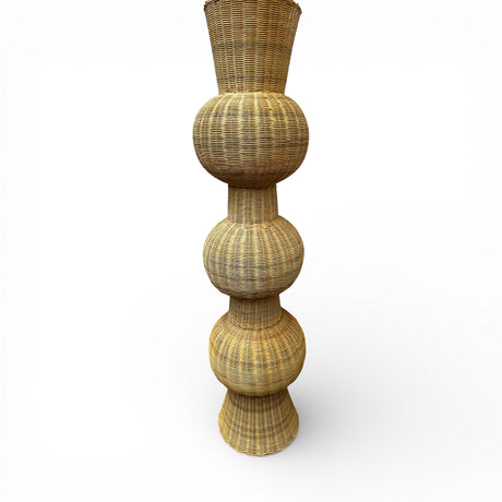 Tall handwoven sculptural floor vase featuring a natural wicker finish and a striking stacked bulb silhouette. A statement décor piece perfect for styling entryways, living rooms, covered patios, boutique hotels, or contemporary interiors.