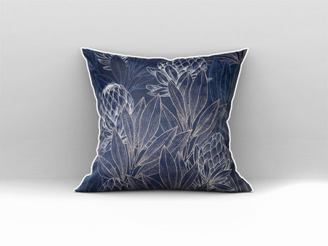 Decorative navy blue scatter cushion featuring elegant protea flowers and botanical linework in soft silver tones, finished with contrasting light piping.