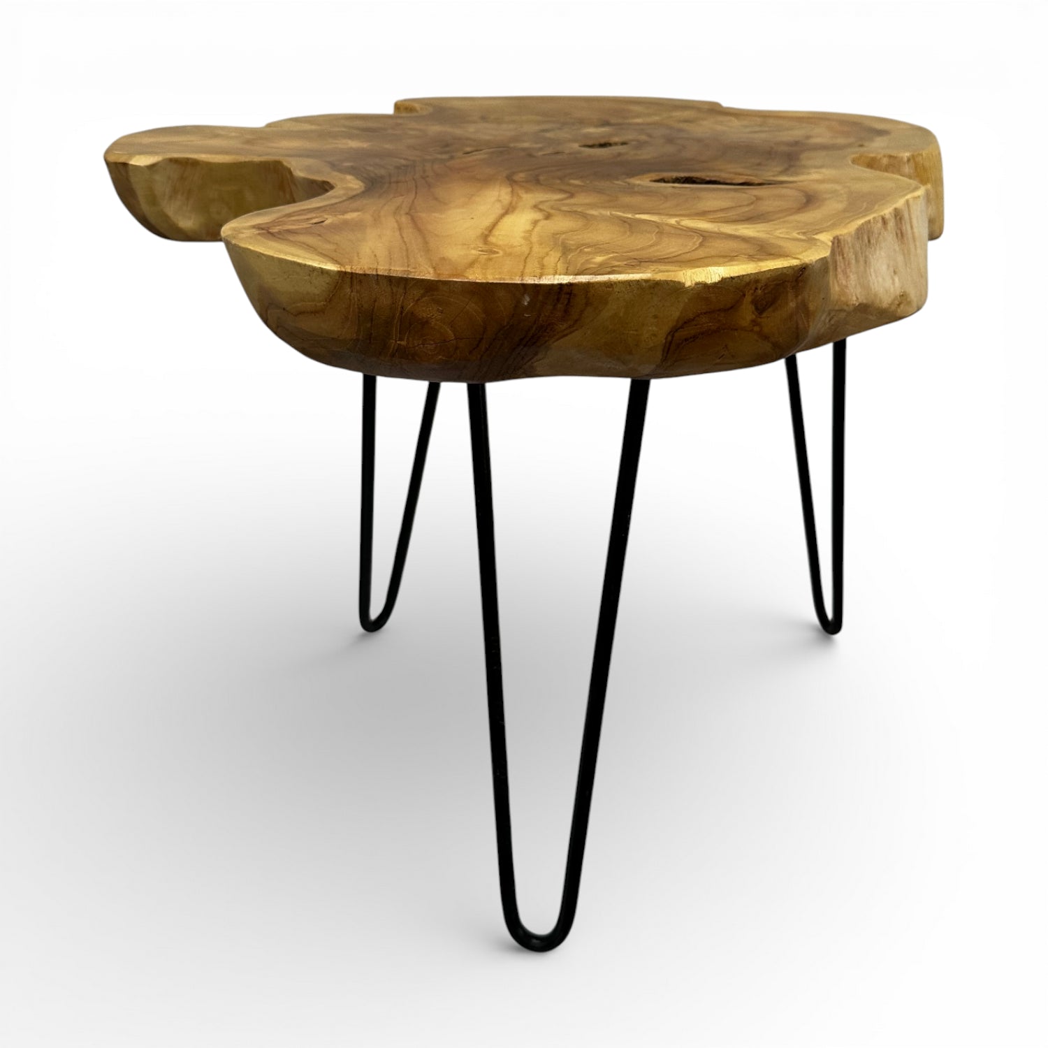 Handcrafted coffee table featuring a freeform live edge solid wood tabletop with rich natural grain, knots, and organic contours, supported by sleek black metal hairpin legs. A one-of-a-kind statement piece that blends rustic craftsmanship with modern industrial style, perfect for living rooms, boutique hotels, lodges, or contemporary interiors.