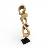 Handcrafted abstract wooden sculpture featuring flowing interlocking loops carved from solid natural wood and mounted on a sleek black display stand. This contemporary statement piece adds sculptural elegance and organic texture to living rooms, offices, boutique hotels, entryways, or luxury interiors.
