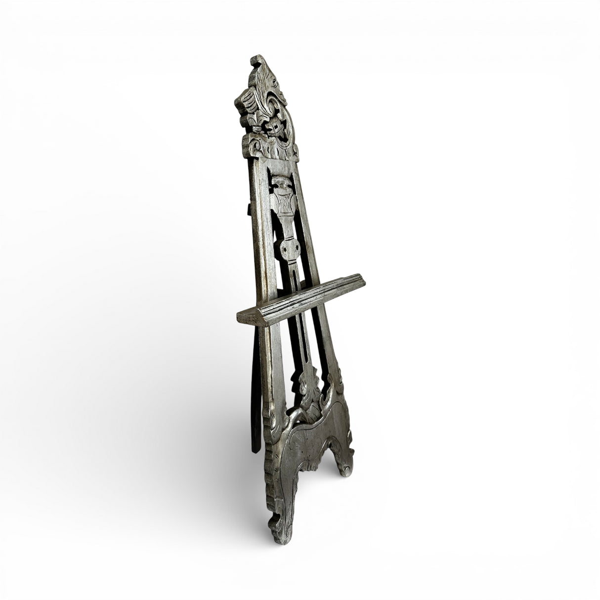 Handcrafted vintage-style wooden display easel with intricate carved detailing, distressed grey finish, and adjustable support, ideal for displaying artwork, mirrors, signage, or decorative pieces.