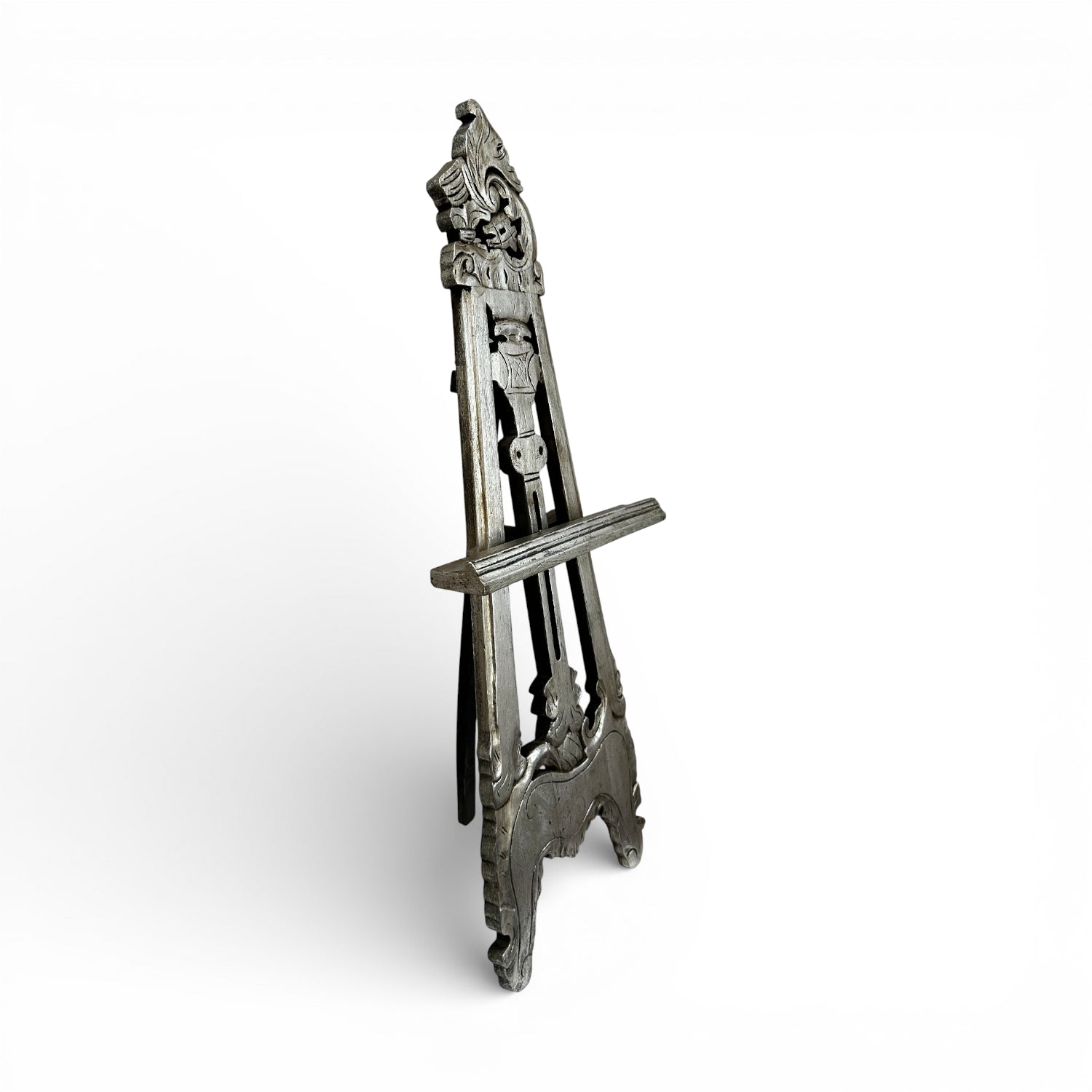 Handcrafted vintage-style wooden display easel with intricate carved detailing, distressed grey finish, and adjustable support, ideal for displaying artwork, mirrors, signage, or decorative pieces.