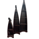 Set of three handcrafted canoe-shaped display shelves in a dark stained wood finish, featuring open shelving for decorative accents, books, and collectibles, displayed against a white background.